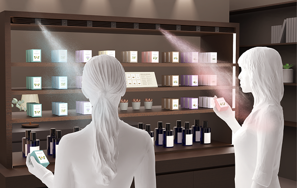 香水売り場で商品を手に取ると、開封せずに香りが体験できる様子