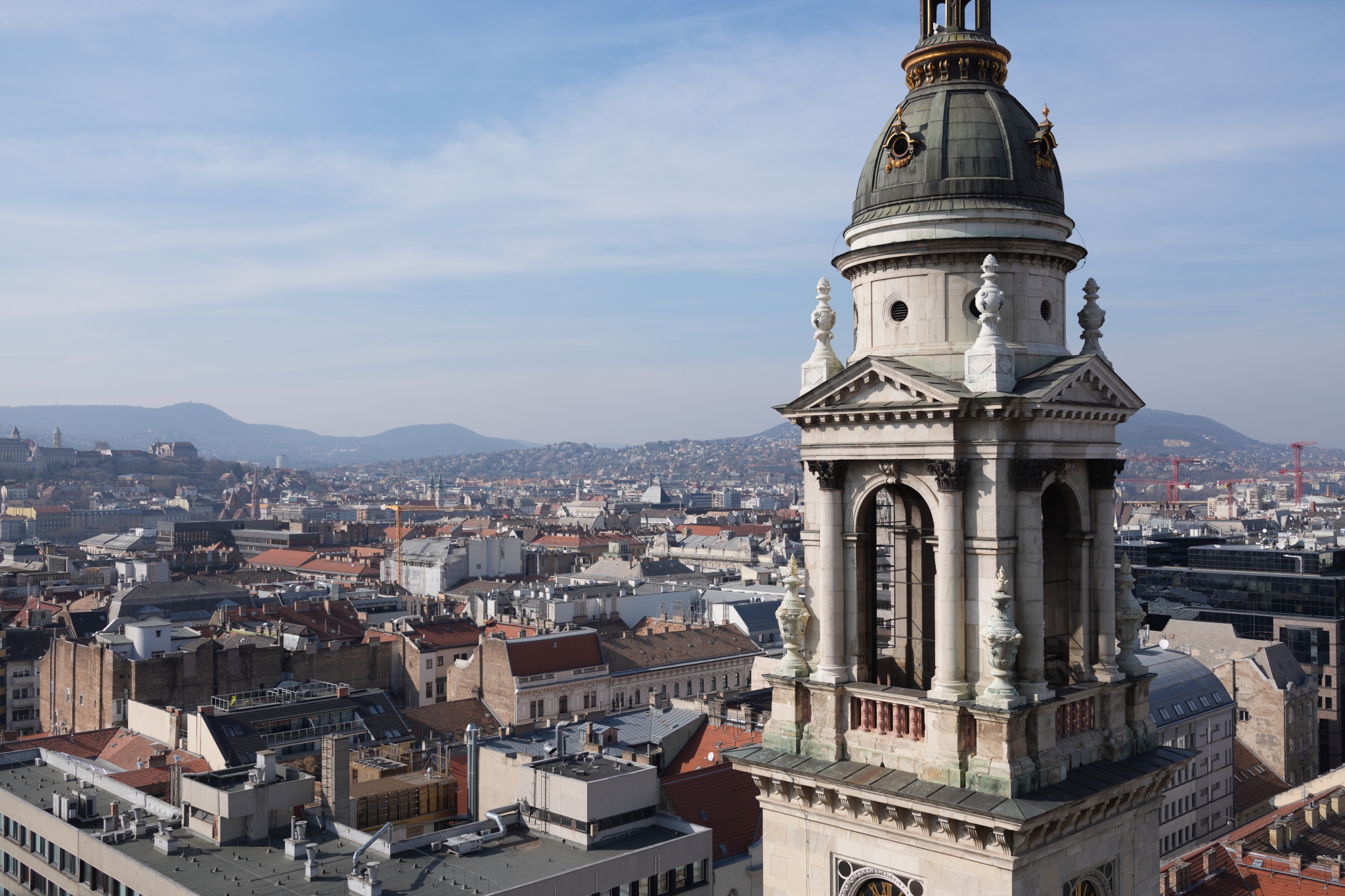 A sample image featuring a large tower prominently in the foreground and a cityscape stretching out into the distance Click to open modal