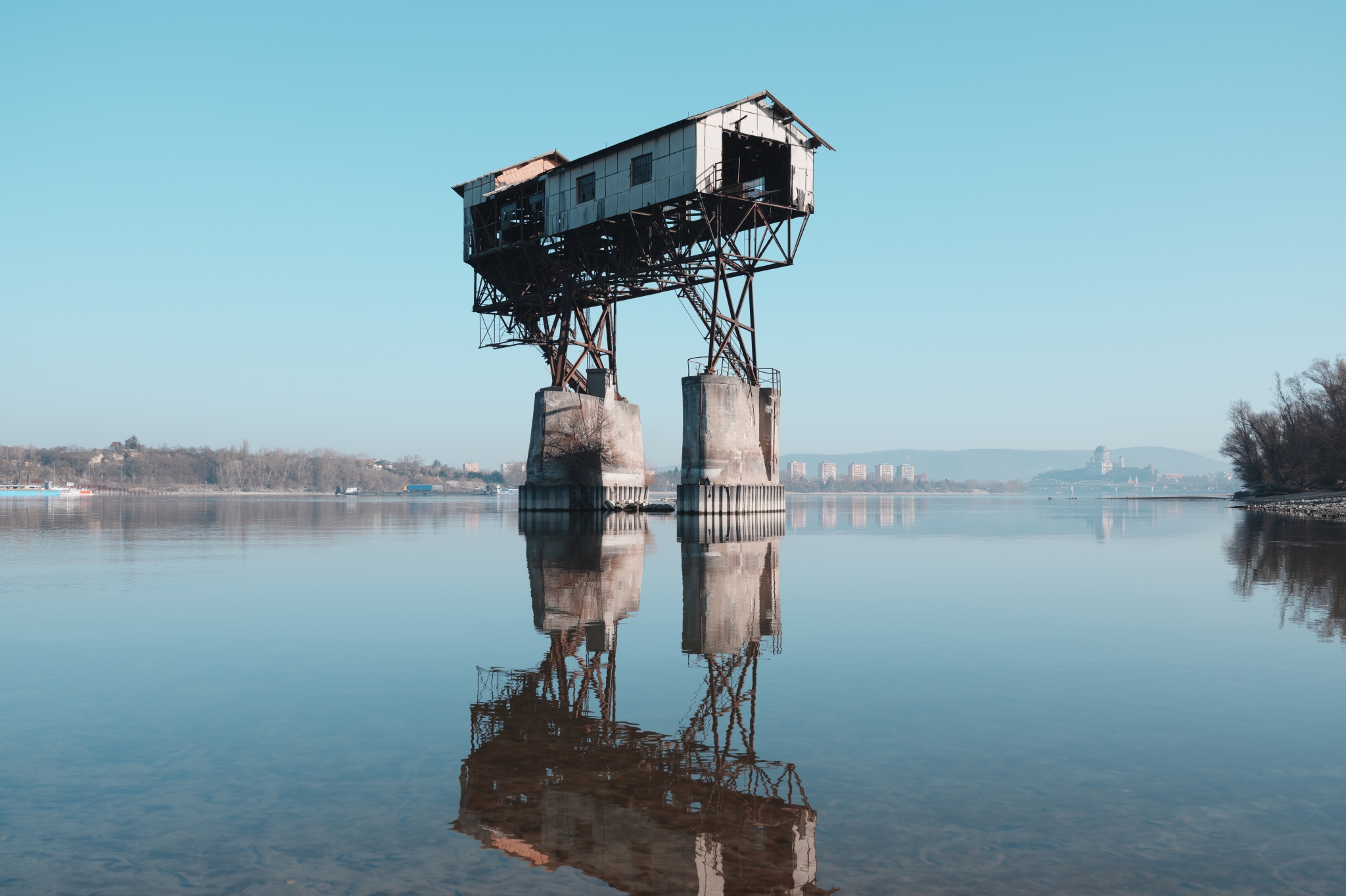 A sample image of a building built on the water end reflecting in blue sky, taken in Creative Look FL3 mode. Click to open modal