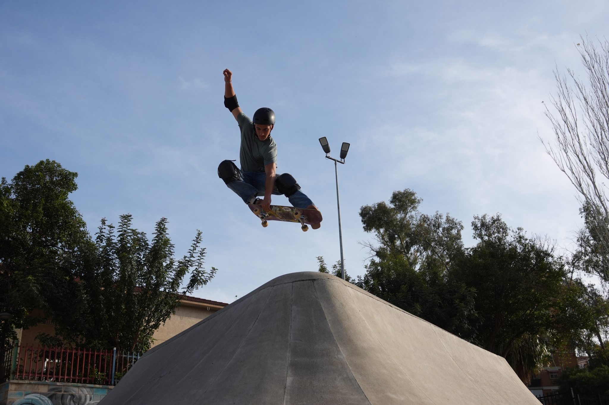 A sample image of the male skater jumping on the ramp Click to open modal