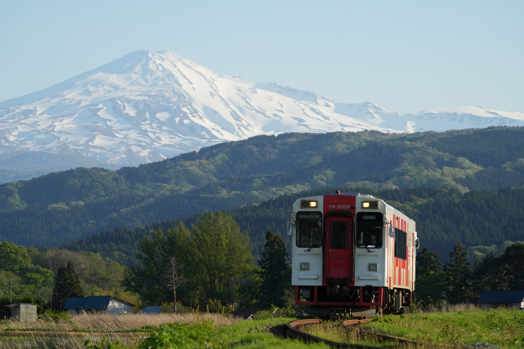 A train running through a vast, open landscape. Click to open modal