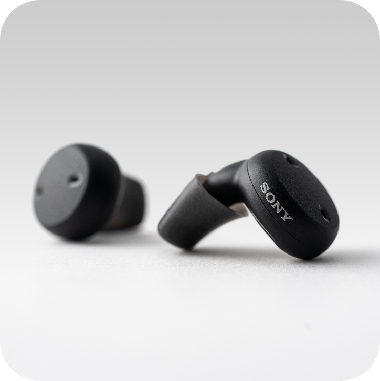 Left and right earphones Self-Fitting OTC Hearing Aids are placed